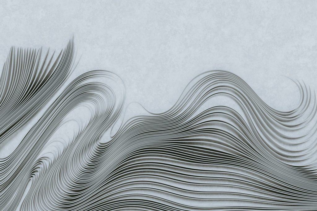 Arrière-plan abstrait comportant des lignes grises et noires fluides ressemblant à des vagues.